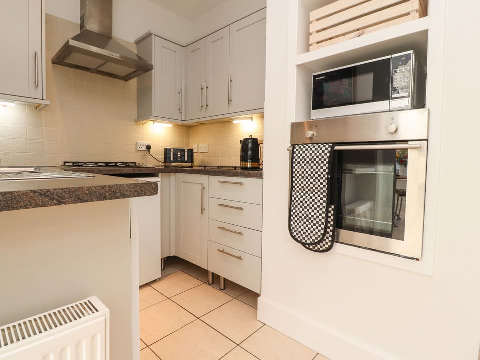 Fridge, electric kettle, toaster, cookware/dishes/utensils