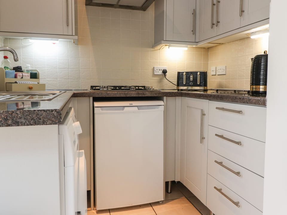 Fridge, electric kettle, toaster, cookware/dishes/utensils