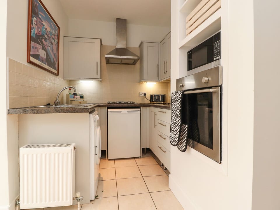 Fridge, electric kettle, toaster, cookware/dishes/utensils