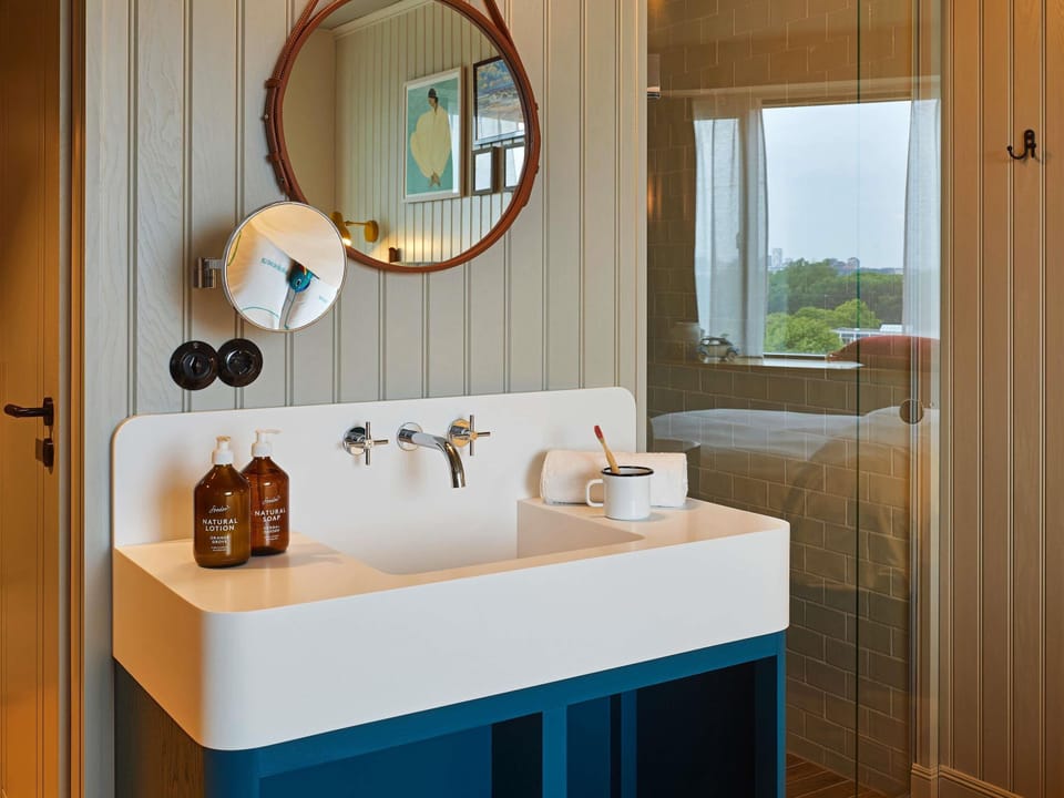 Medium Room | Bathroom | Shower, rainfall showerhead, eco-friendly toiletries, hair dryer