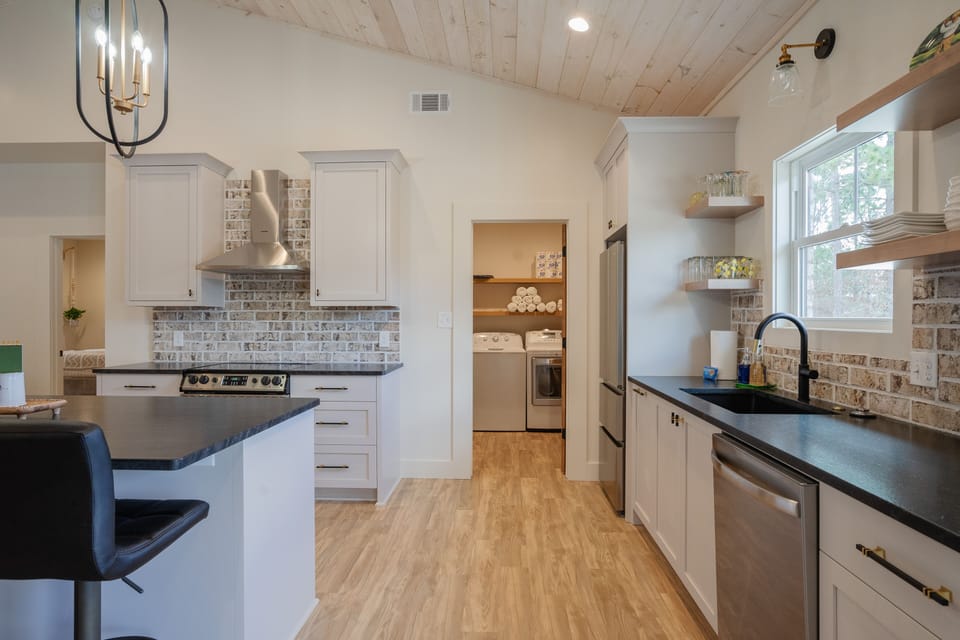 Laundry room with washer, dryer, and essentials — ideal for families