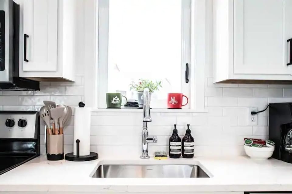 Pictured here is our big sink with our high quality hand/dish soaps along with the big coffee mugs for you to enjoy your morning coffee with!