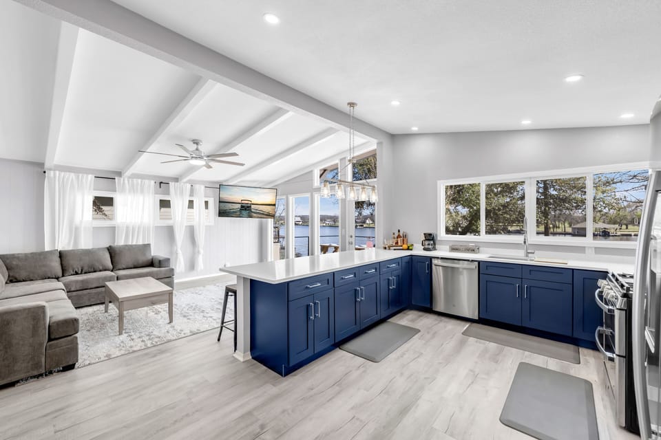 Gorgeous lake views from the modern open living and kitchen area.