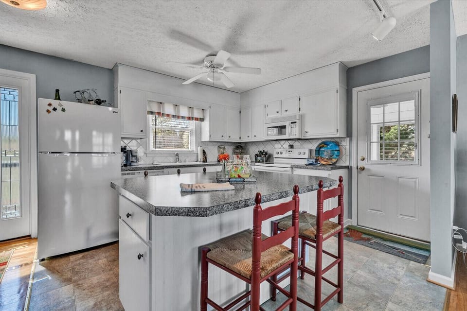 Enjoy casual dining with stylish bar seating that overlooks the kitchen.