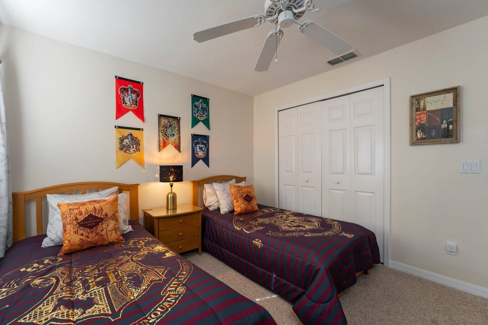 Bedroom 5 upstairs showing 2-twin beds and ceiling fan