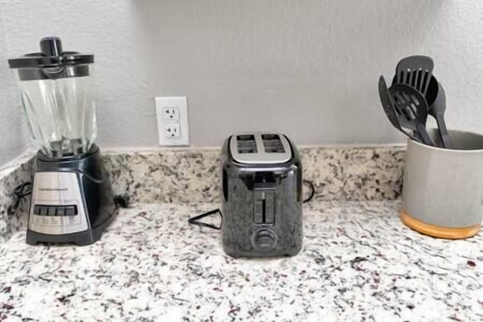 blender, bread toaster and kitchen utensils