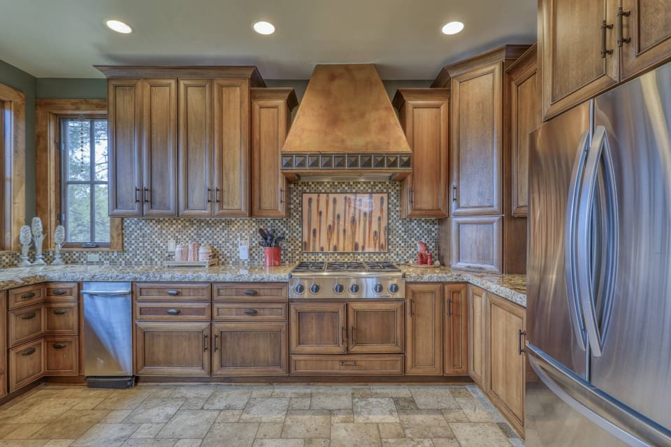 Fully stocked kitchen with high end appliances and gas cook top