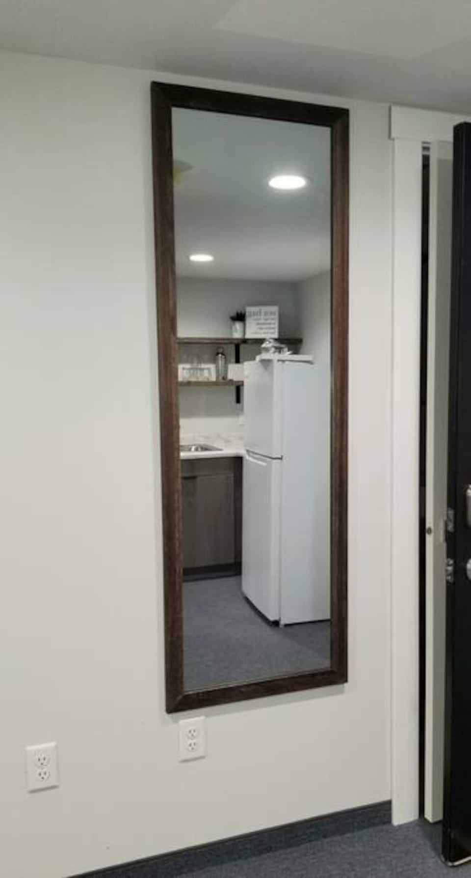 Full length mirror is there so people can get ready outside of the bathroom. Plug ins are in the perfect location to get ready. 