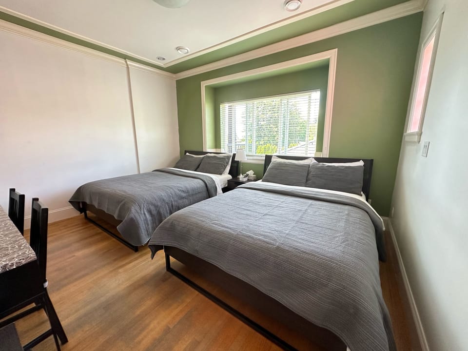Deluxe Quadruple Room, 2 Queen Beds, Private Bathroom (Room G) | Desk, free WiFi, bed sheets