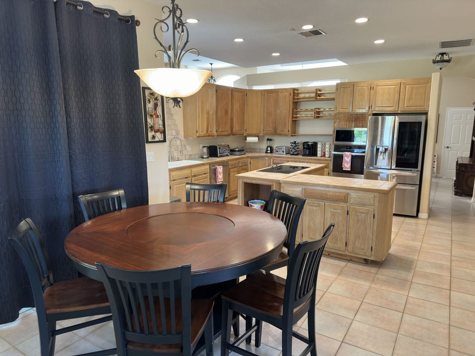 Dining area next to kitchen and patio