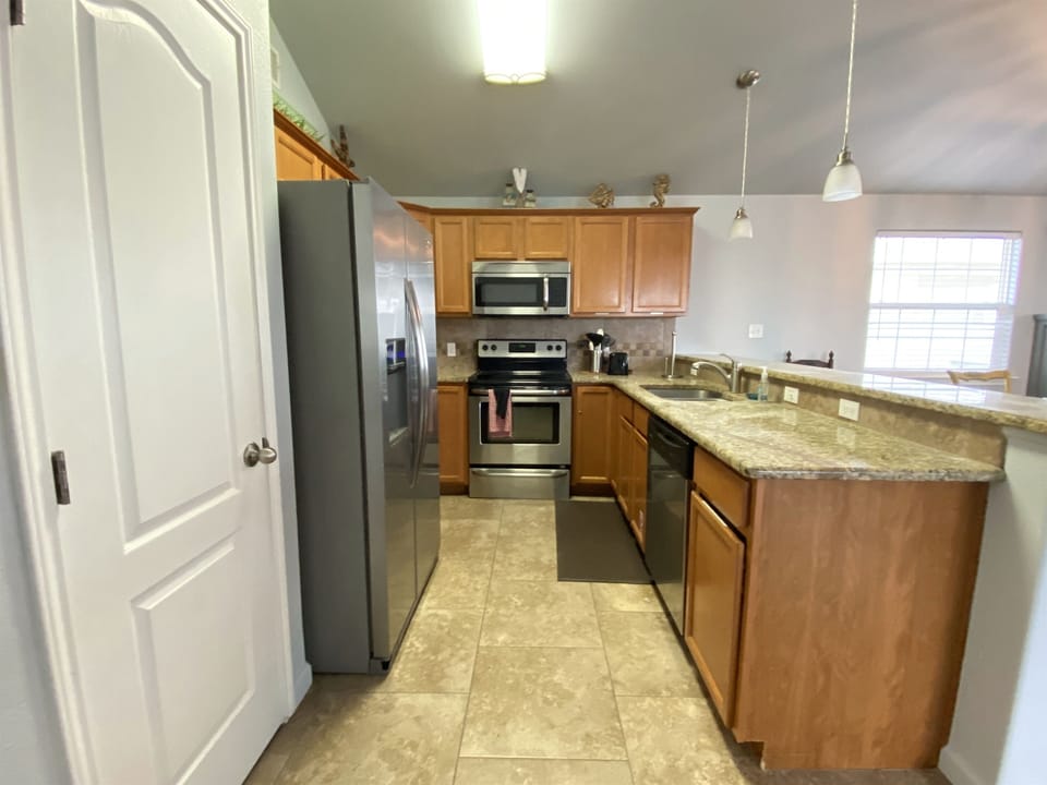 Electric range, microwave, dishwasher and large refrigerator. Stocked with what you need to feed your family.