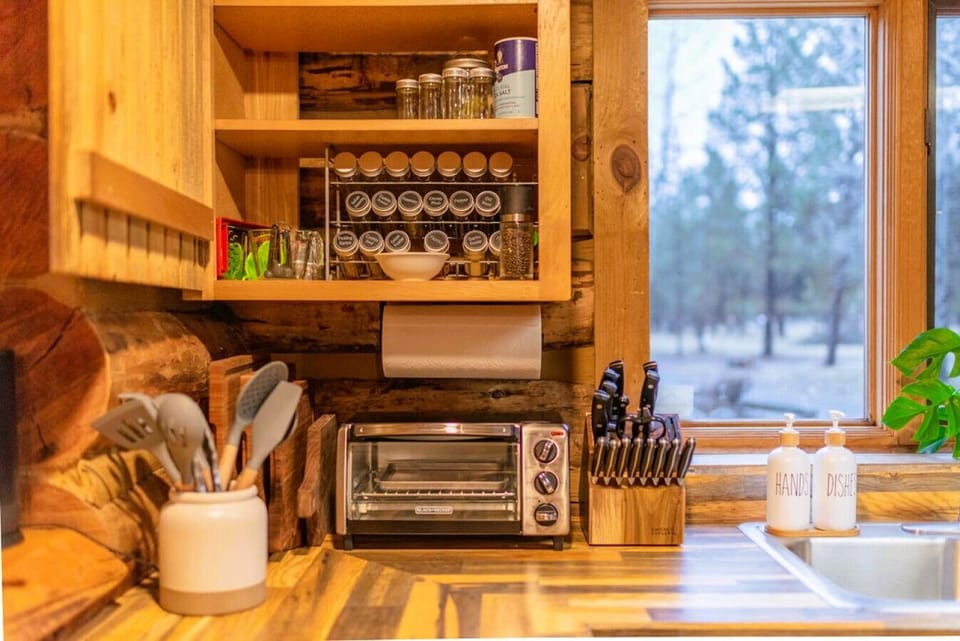 Kitchen stocked with a toaster oven, full knife set, and everything you need to cook