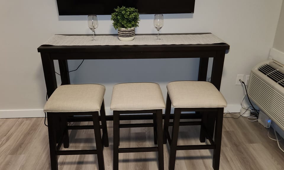 Dining table with pull out stools
