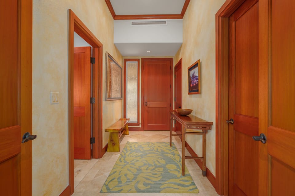 As you enter condo, bedroom 2 is on your right.  To your left is the laundry room.  Straight ahead is the kitchen and then the living room.