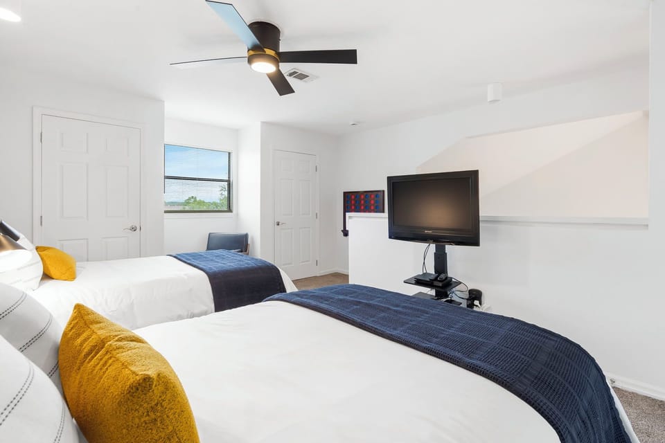 Open layout in loft bedroom with 2 cozy full size beds, TV with cable and DVD.