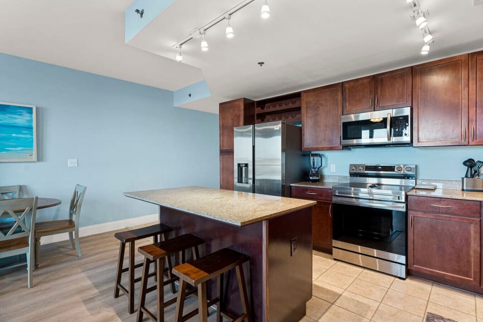Fully Stocked Kitchen with Island Bar Seating, Stainless Steel Appliances and Drip Coffee Maker