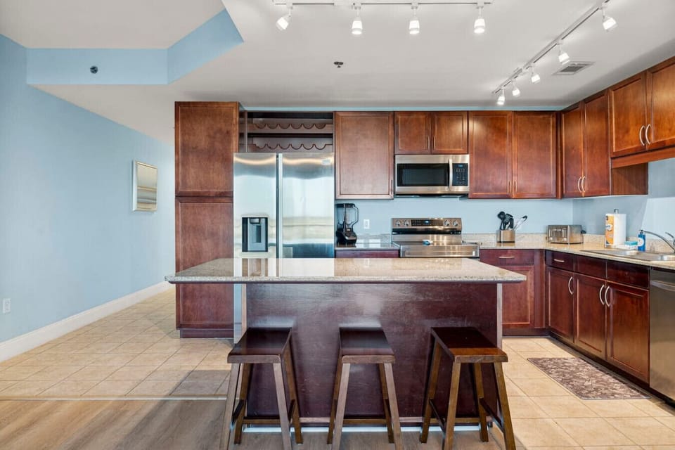 Fully Stocked Kitchen with Island Bar Seating, Stainless Steel Appliances and Drip Coffee Maker
