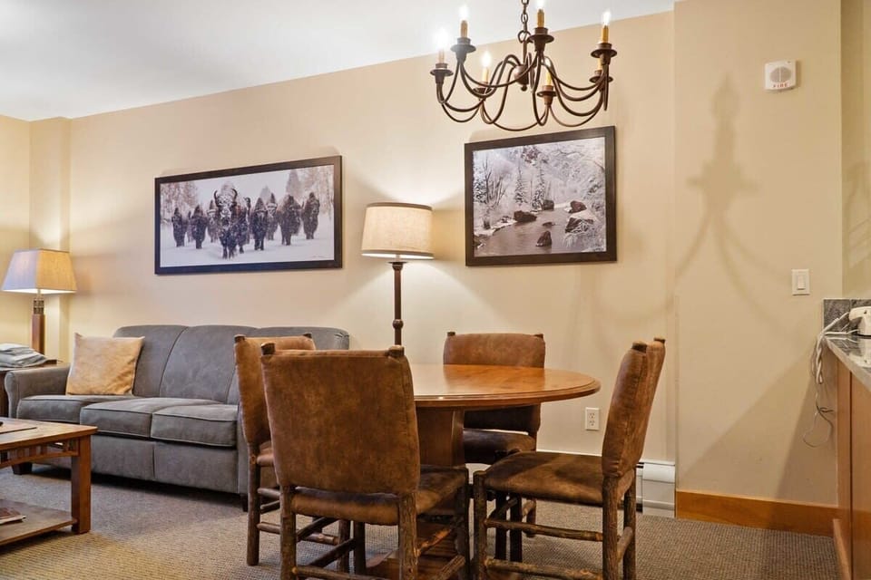 A round dining table with seating for 4 is conveniently placed on the other side of the kitchen counter and is centrally located between the living room and kitchen.