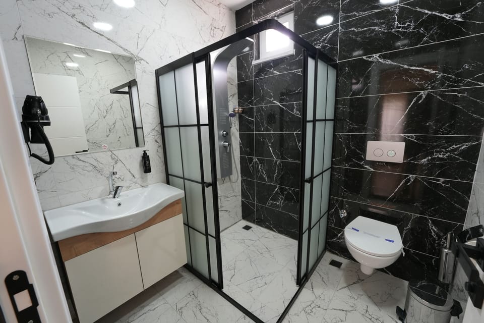 Junior Room | Bathroom | Free toiletries, hair dryer, slippers, towels