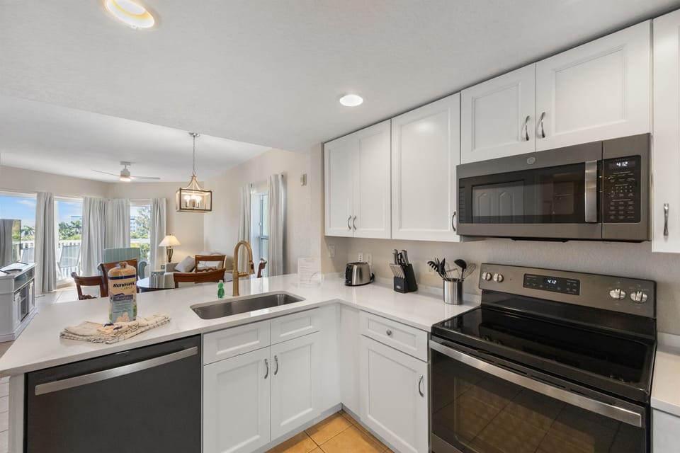 Kitchen, fully stocked with dining and drinking utensils