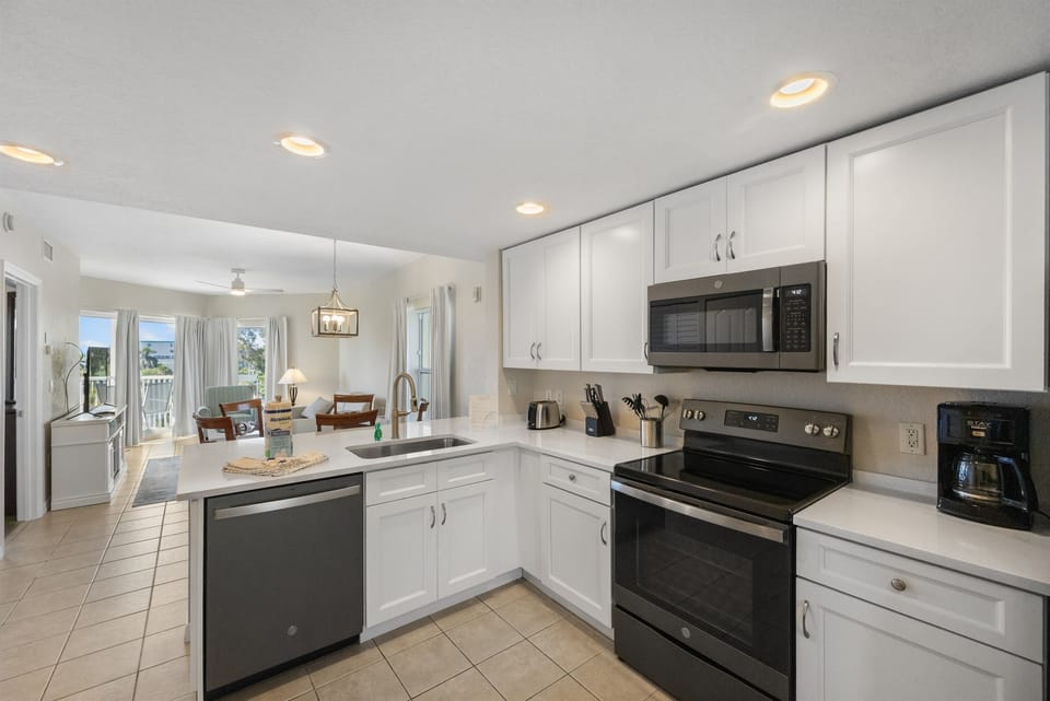 Kitchen, fully stocked with dining and drinking utensils