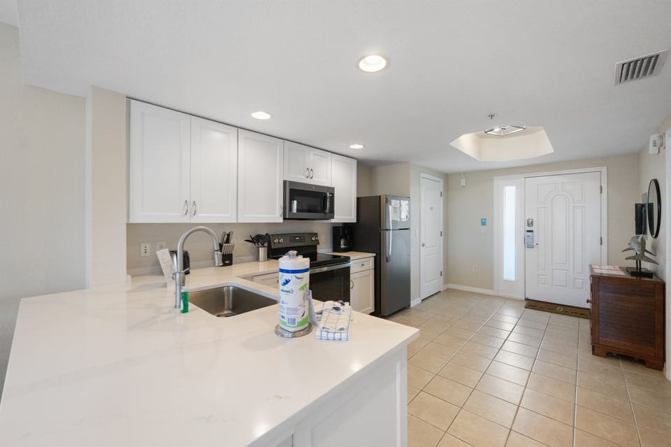 Kitchen, fully stocked with dining and drinking utensils