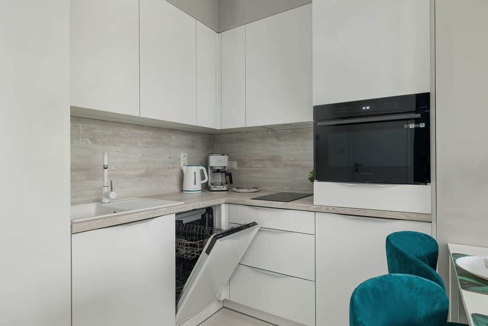 Another perspective of the kitchen and dining area, emphasizing the open-concept design and bright, welcoming atmosphere.

