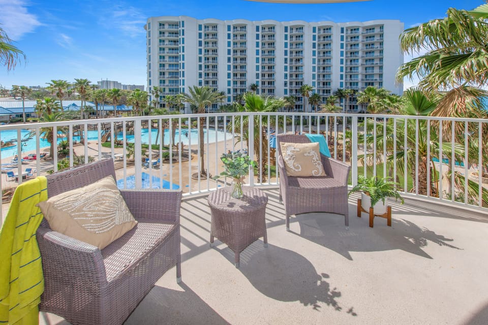 Step onto your private balcony and soak in stunning pool views. Relax in comfortable wicker seating while enjoying tropical breezes.