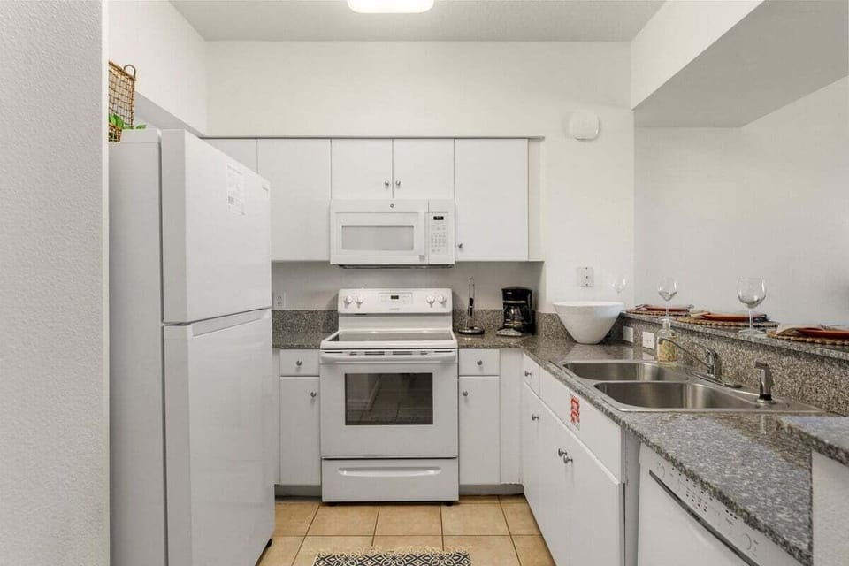 The kitchen is stocked with essential tools and appliances, making meal preparation simple and enjoyable.