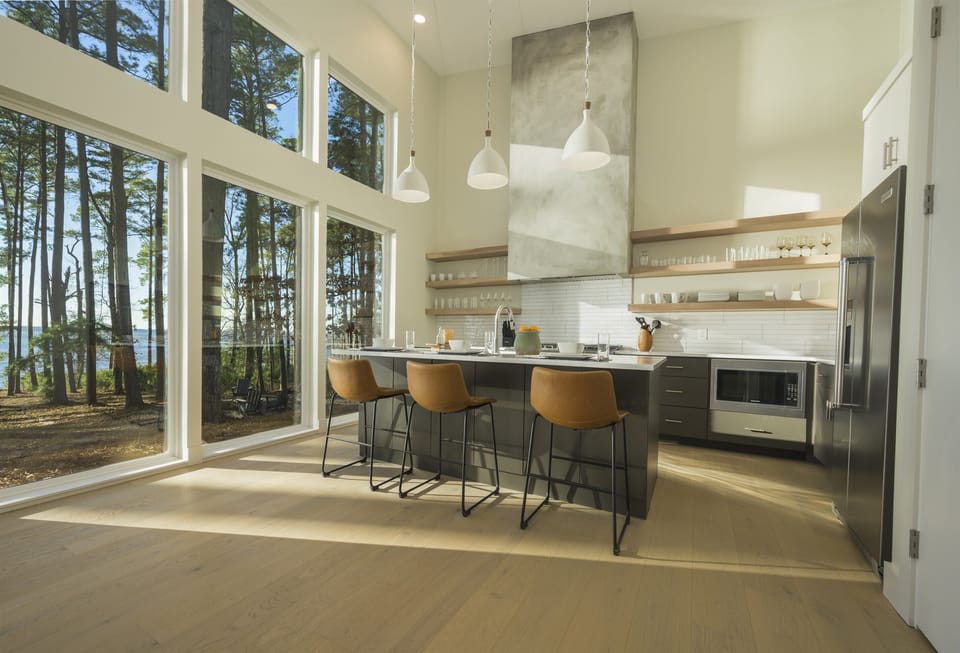 Kitchen: Bright and airy culinary haven with stunning forest views and modern finishes!