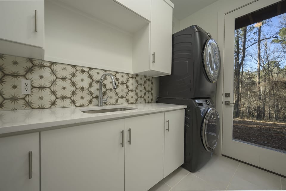 Laundry Room: Modern appliances and a scenic view make laundry a breeze in Avinger!