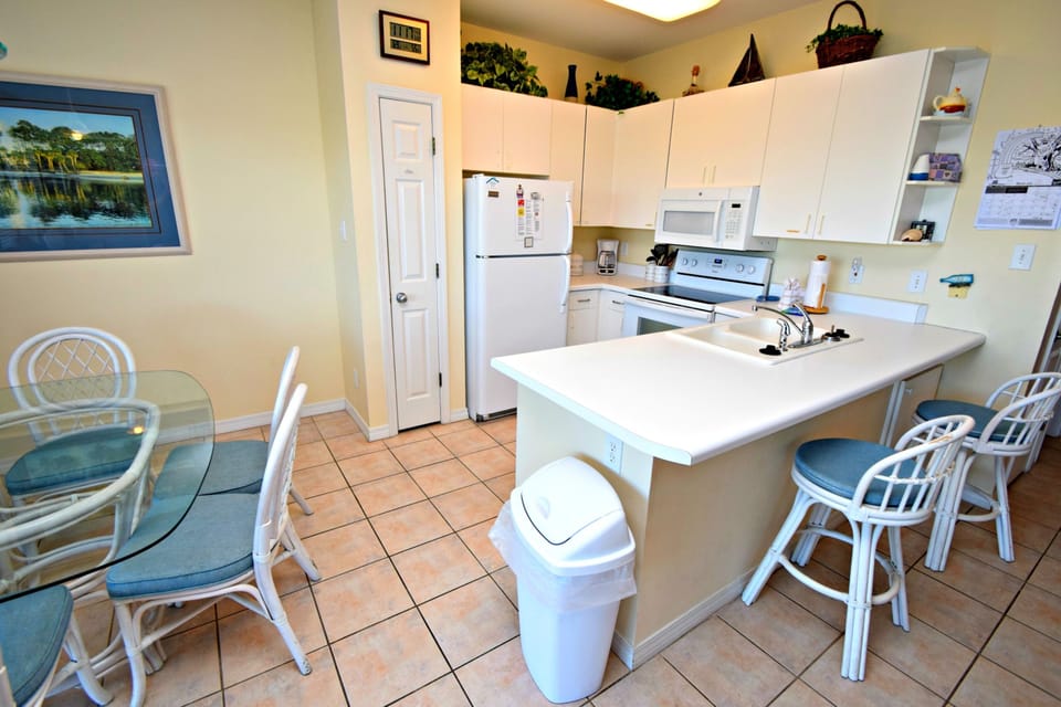 Condo, Multiple Beds, Balcony, Pool View (Romar Lakes A302) | Private kitchen | Coffee/tea maker