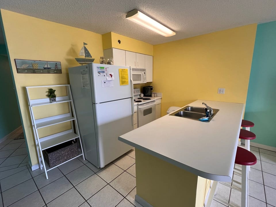Condo, Multiple Beds, Balcony, Pool View (Tradewinds 507) | Private kitchen | Coffee/tea maker
