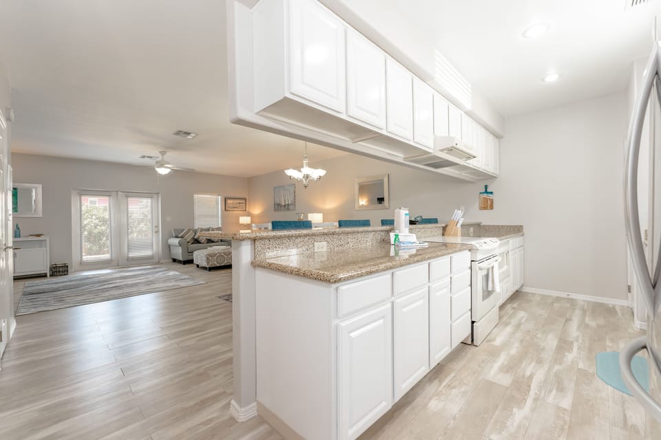 This open-concept condo keeps the conversation going no matter where you are!
