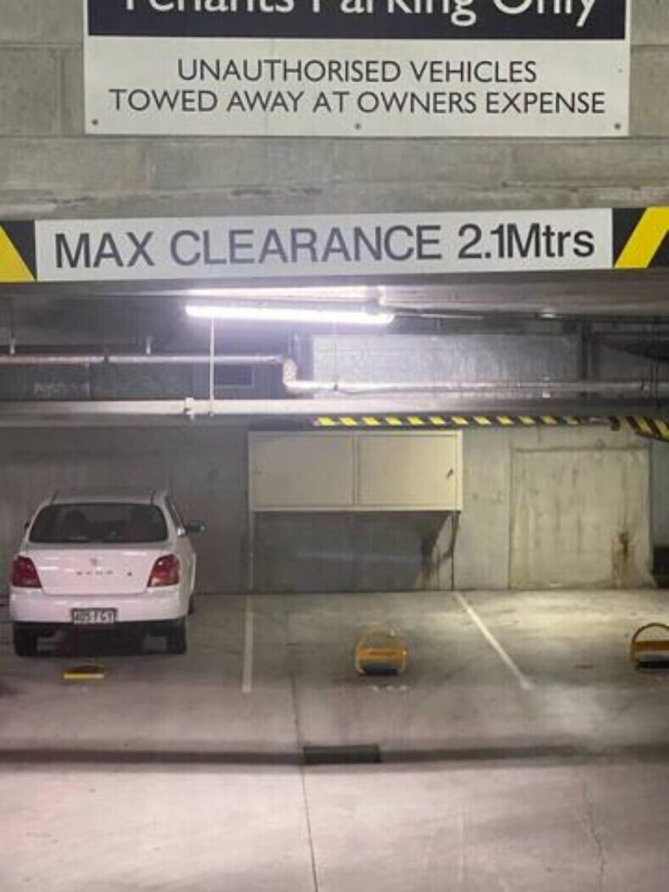 Secure undercover parking with 2.1m maximum vehicle clearance.