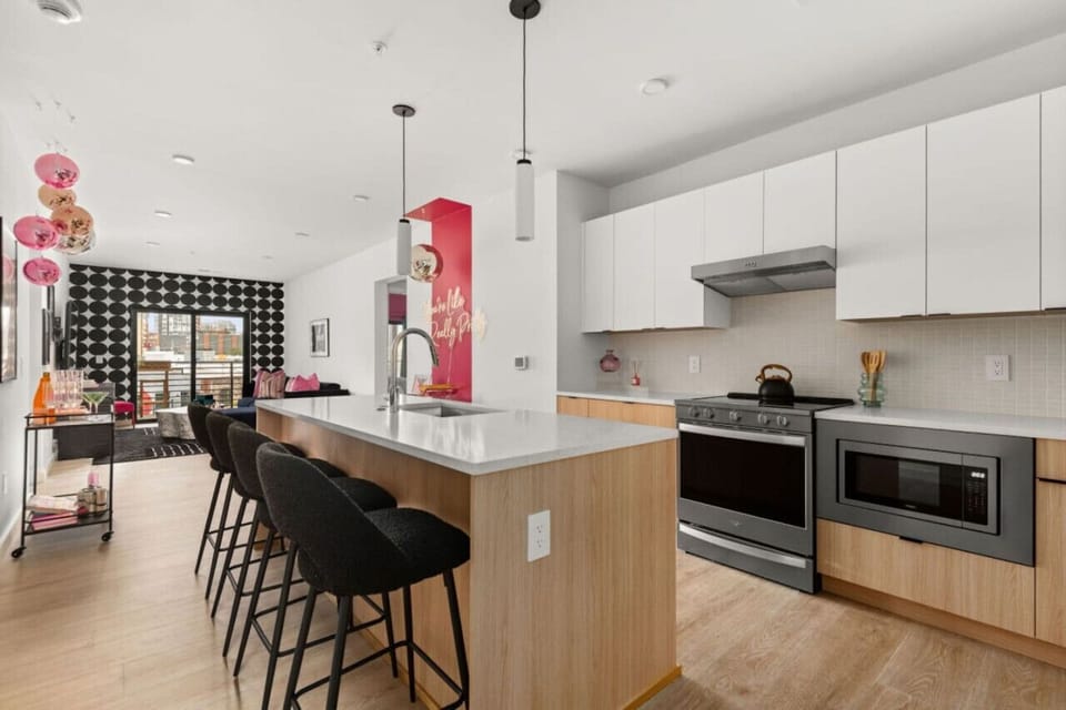 Open space kitchen with all the dishes, condiments, and amenities you could dream of (olive oil, avocado oil, balsamic vinegar. local coffee, tea, sugar, spices, etc)