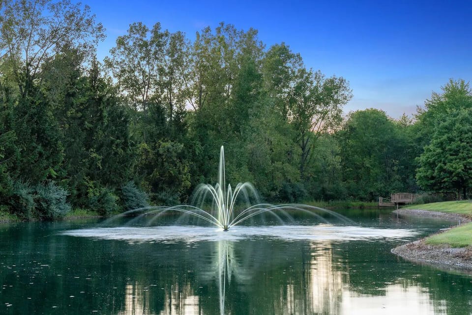 The lake’s stunning fountain creates a tranquil ambiance in the private pond 