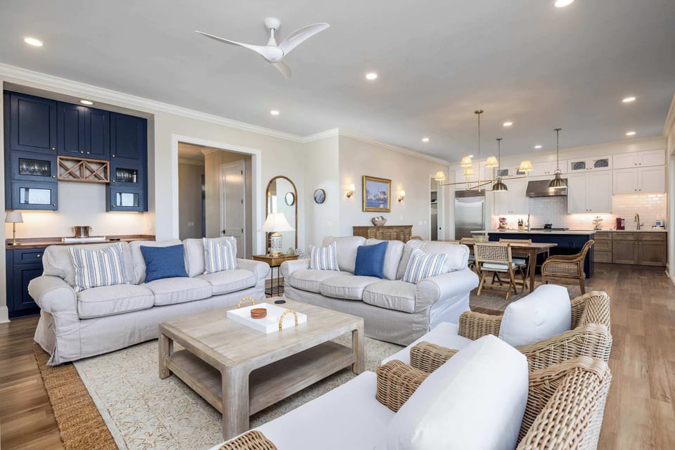 Open Concept Living, Dining and Kitchen Areas with Access to Decks