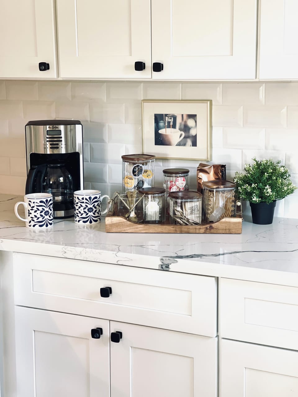 Coffee and tea station with drip maker, Keurig, and electric kettle.