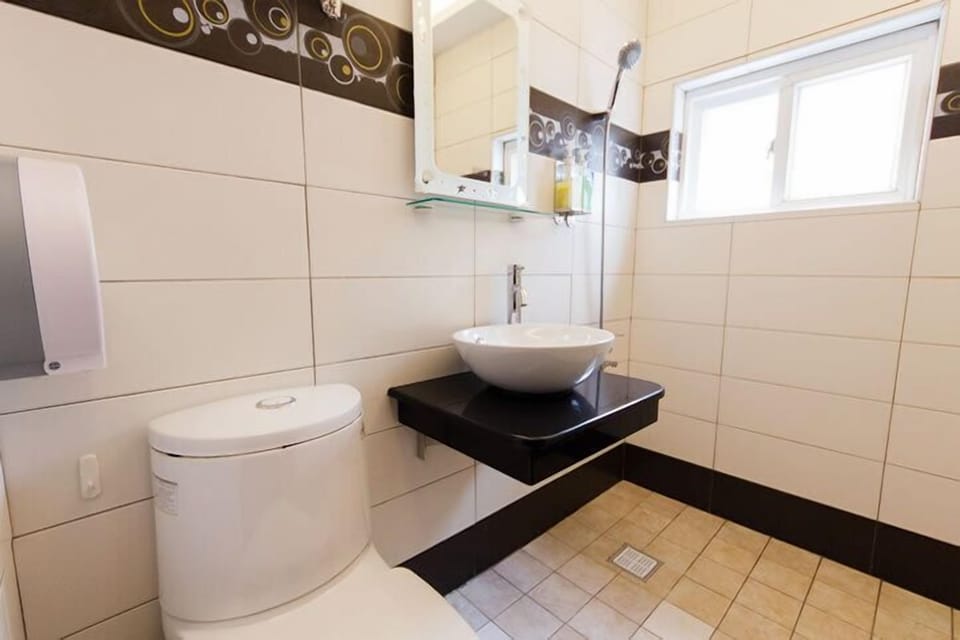 Quadruple Room, 2 Double Beds | Bathroom | Shower, free toiletries, hair dryer, slippers