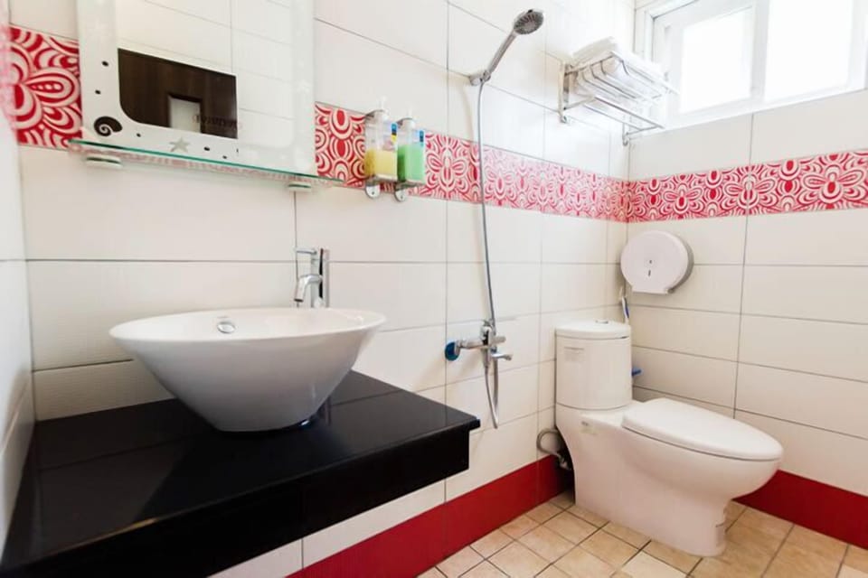 Quadruple Room, Balcony | Bathroom | Shower, free toiletries, hair dryer, slippers