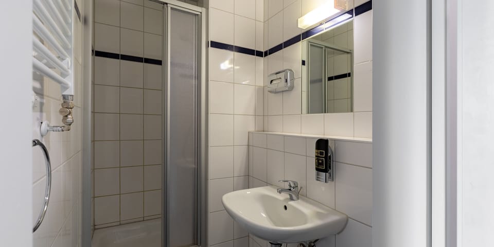 Bed in 4-Bed Dormitory | Bathroom | Shower, eco-friendly toiletries, hair dryer, soap