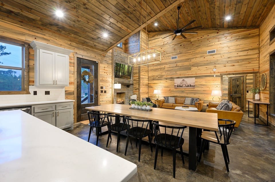 Living Room: Bask in rustic charm with stunning wood accents and a cozy fireplace for gatherings!