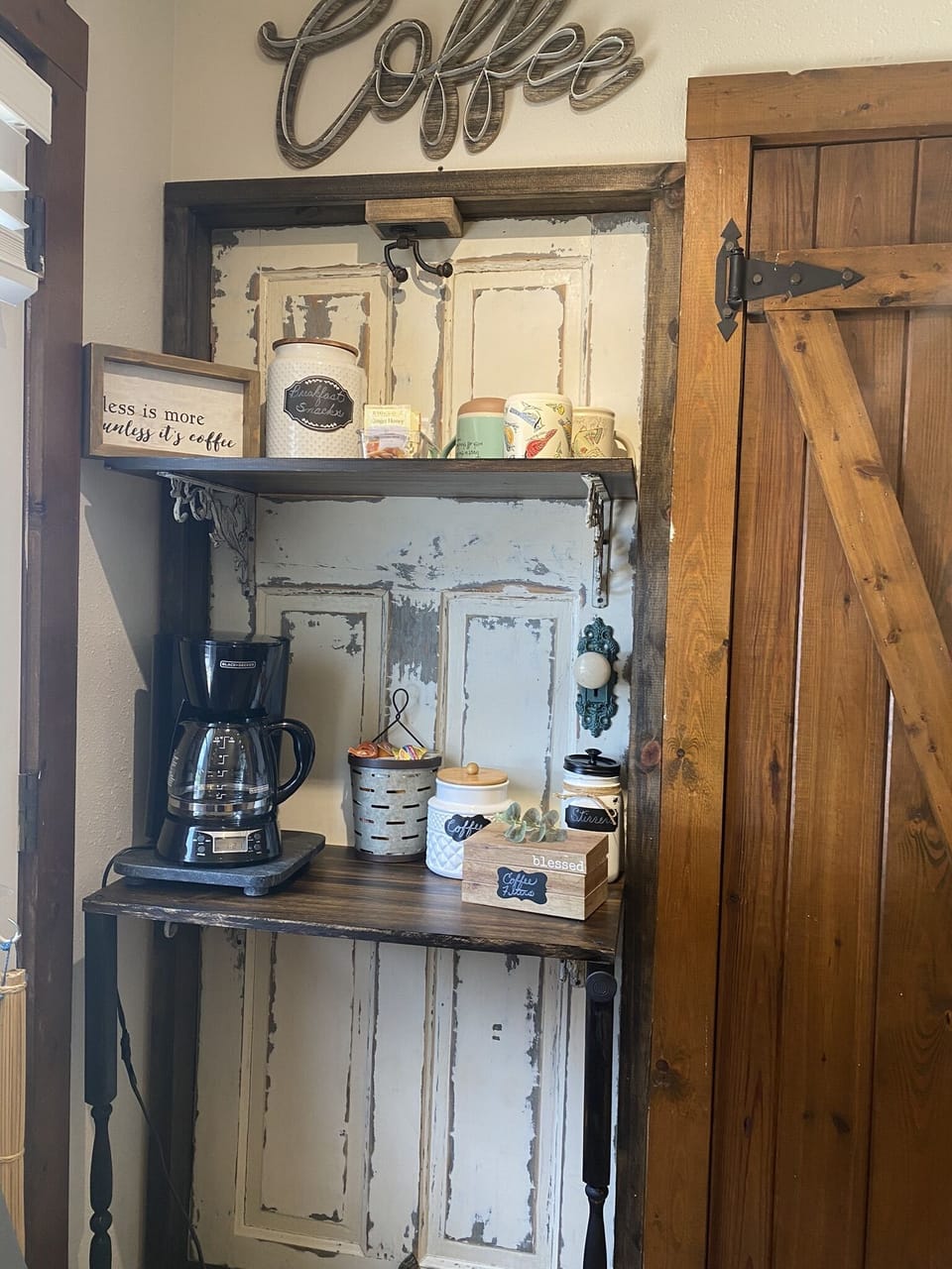 Cute & clean bathroom beyond this barn door
