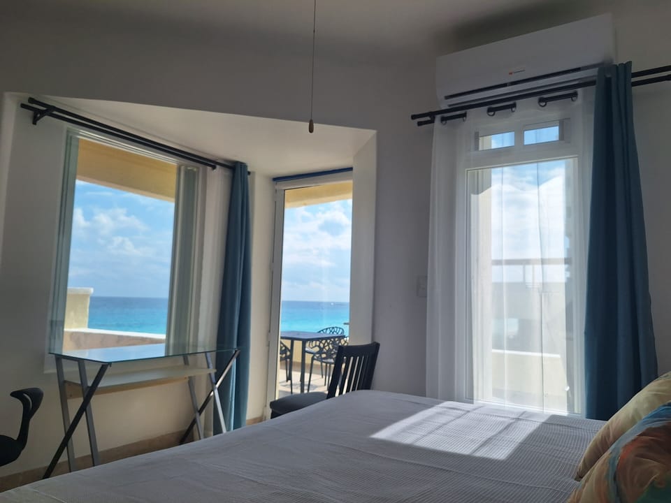 Executive Studio Suite, Beach View | Individually furnished, desk, laptop workspace, blackout drapes
