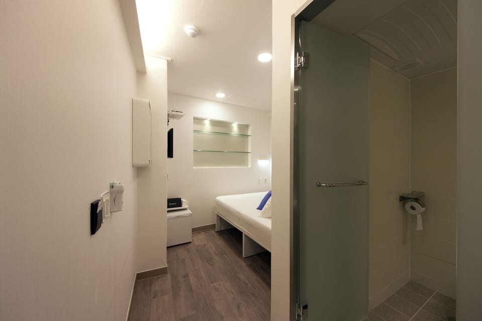 Economy Double Room | Blackout drapes, iron/ironing board, free WiFi, bed sheets