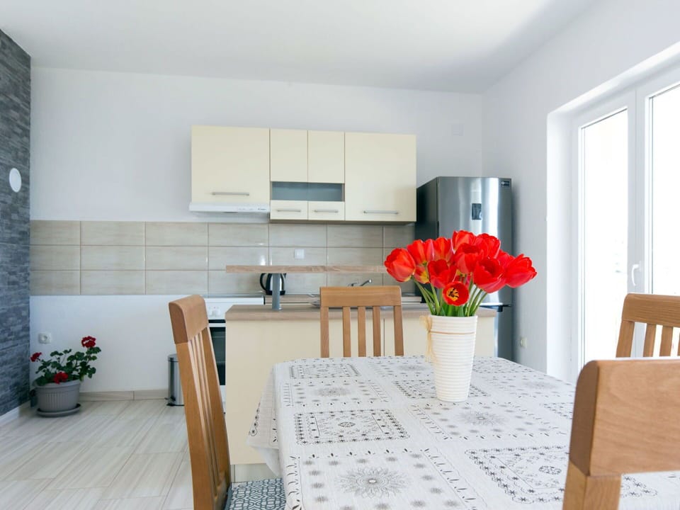 Flower, Plant, Furniture, Property, Table, Building, Flowerpot, Houseplant, Lighting, Cabinetry