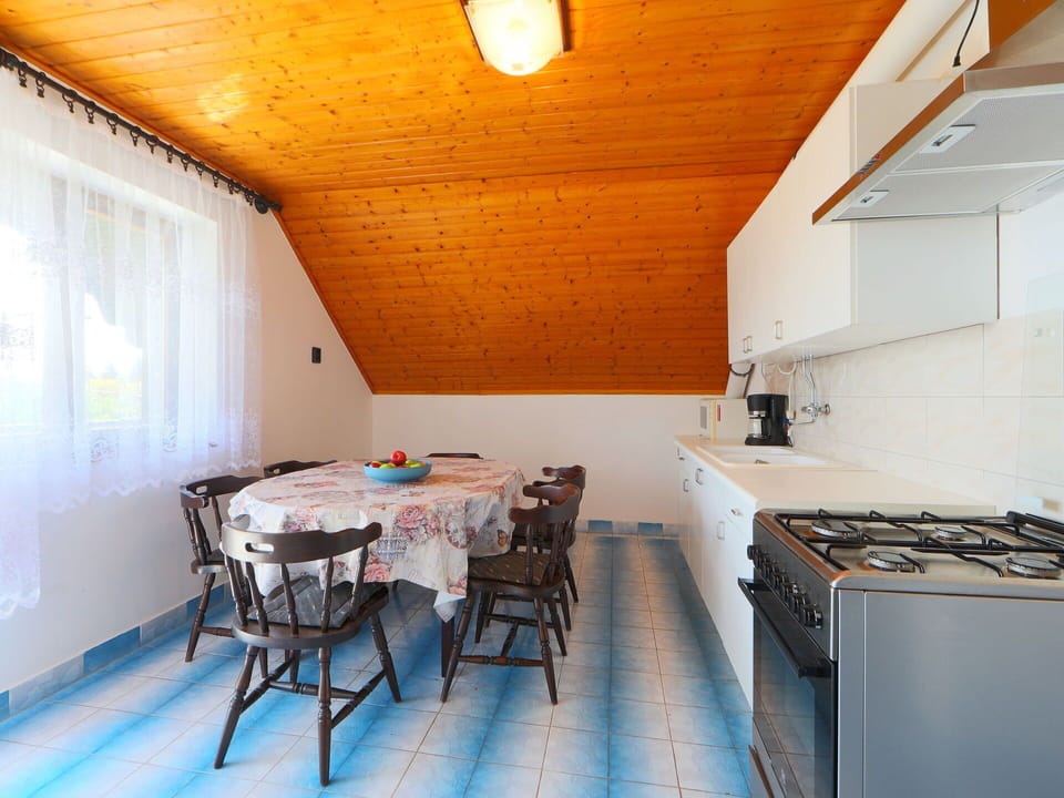 Furniture, Cabinetry, Property, Table, Gas Stove, Wood, Countertop, Interior Design, Cooktop, Chair