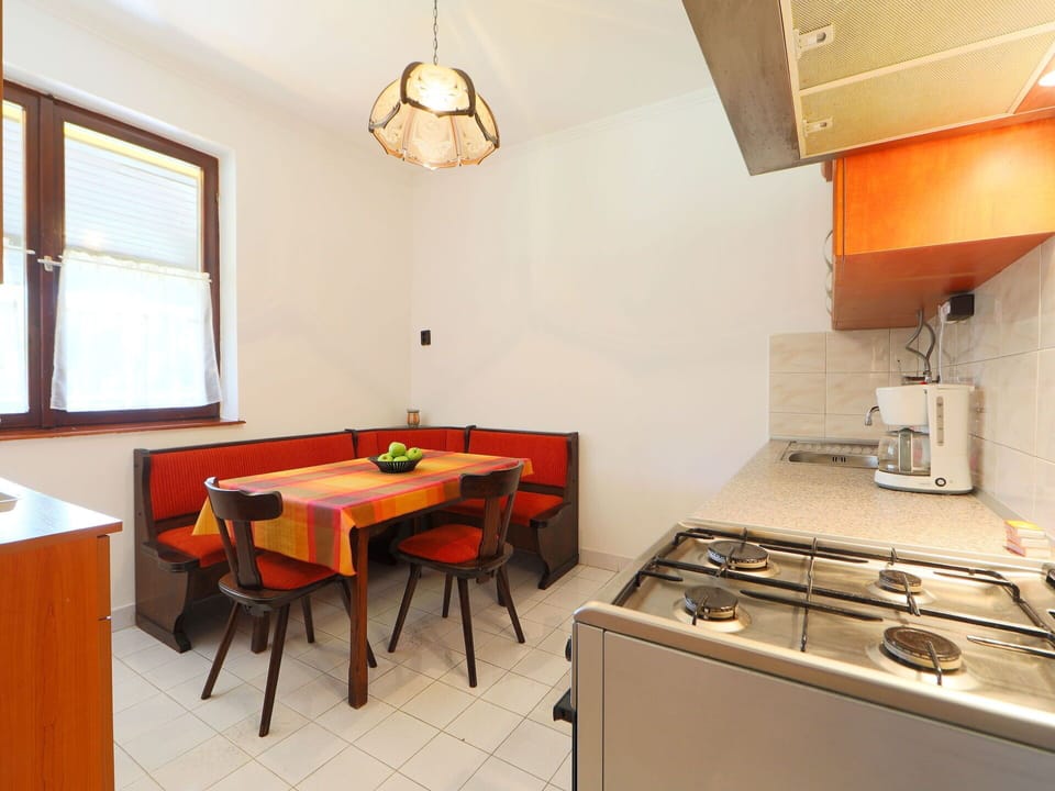 Furniture, Property, Window, Cabinetry, Table, Gas Stove, Exhaust Hood, Wood, Chair, Orange