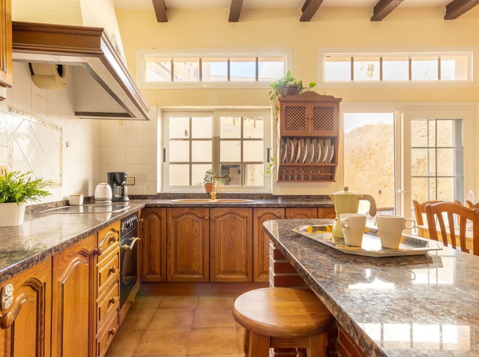 Countertop, Cabinetry, Furniture, Table, Window, Kitchen, Kitchen Sink, Wood, Chair, Building